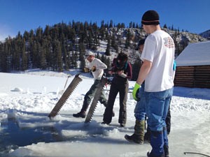 Ice cutters make blocks for the Creede Ice Sculpture Contest, as part of Cabin Fever Daze
