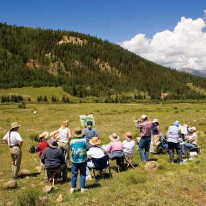 quiller critiques a student's painting in san juan mountain landscape