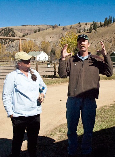 accomplished photographer speaks to class in front of colorado ranch barn