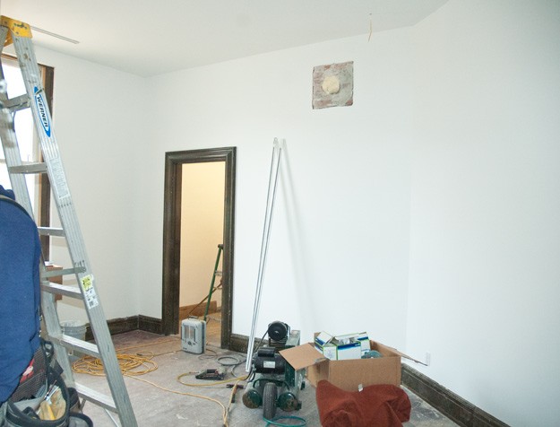 new drywall and white painted art studio inside old historic bathhouse