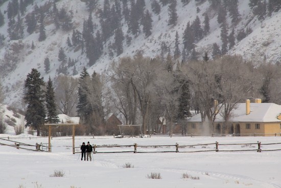 A couple XC skiing in the 4UR Ranch pasture along groomed tracks