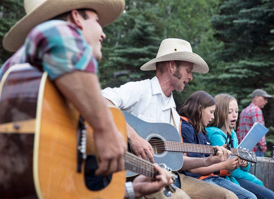 4UR Ranch hands singing with the kids