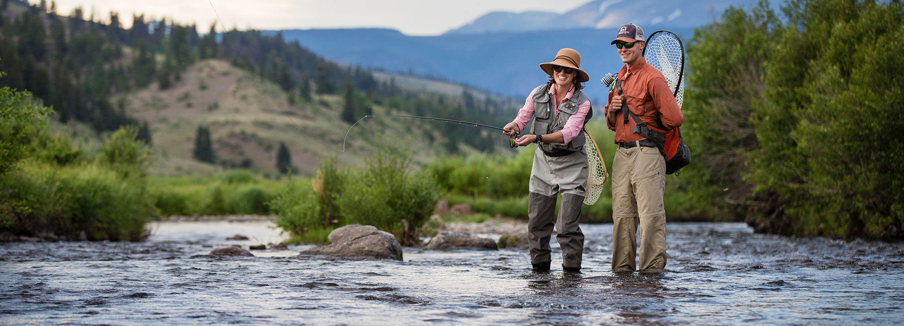 woman and man fly fishing