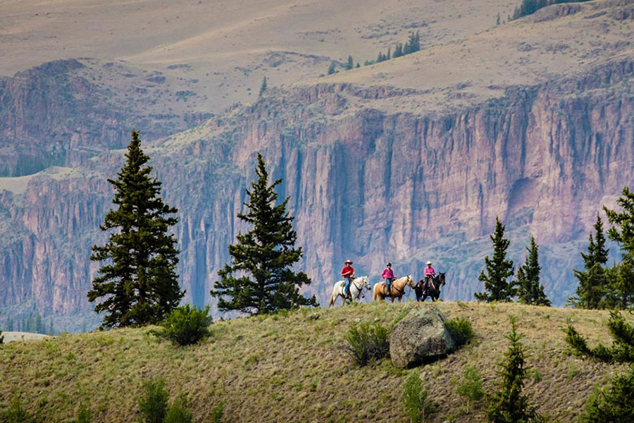 riding horses along ridgeline